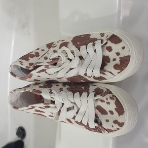 Billabong cow print shoes.
